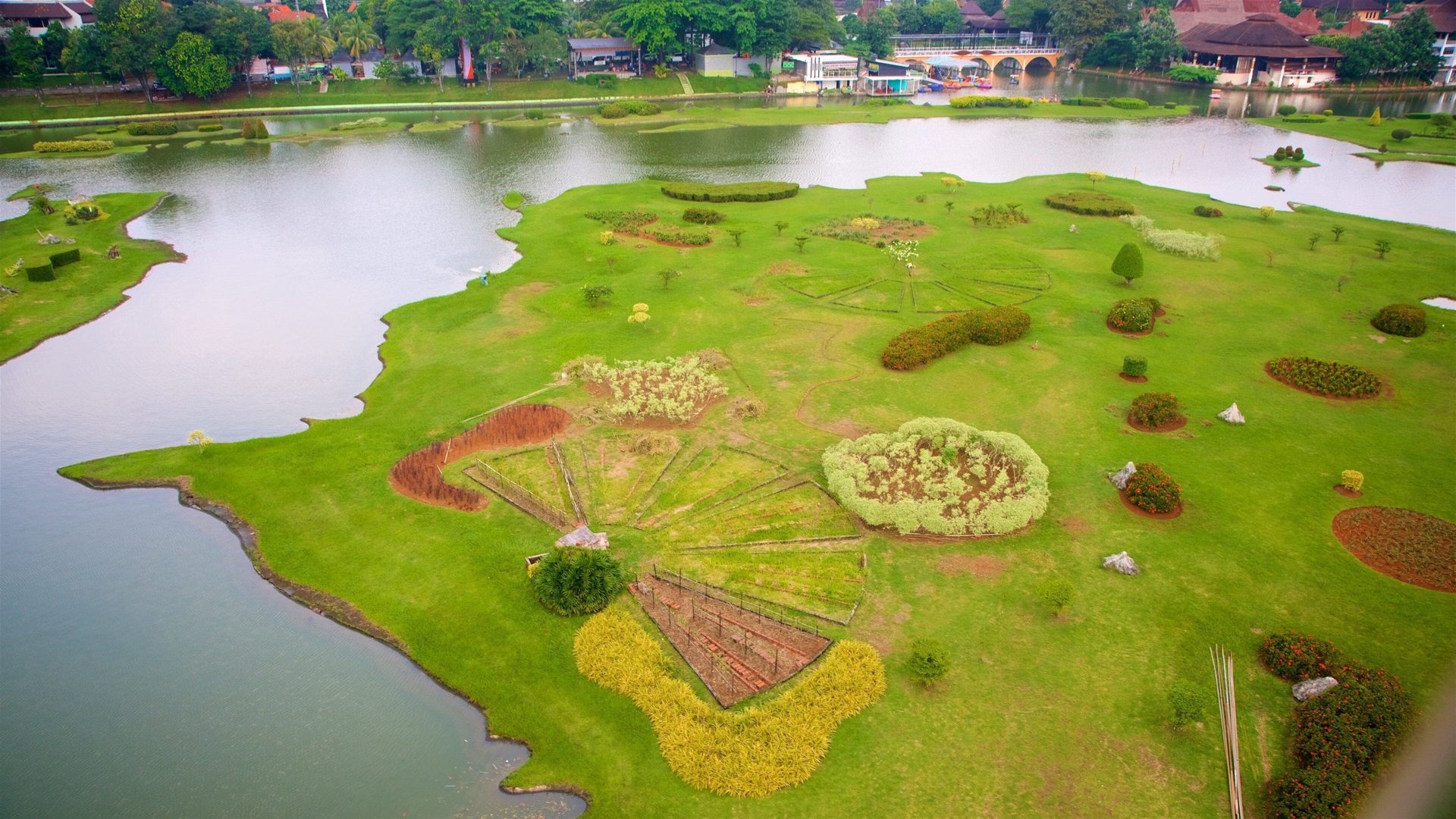 Aerial view of Taman Mini Indonesia Indah's archipelago-map garden and lake in East Jakarta